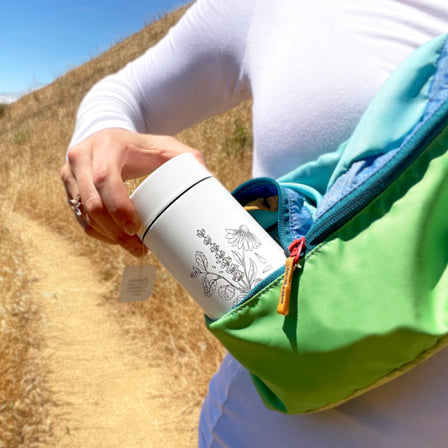 someone holding a Traditional Medicinals Tea Tumbler