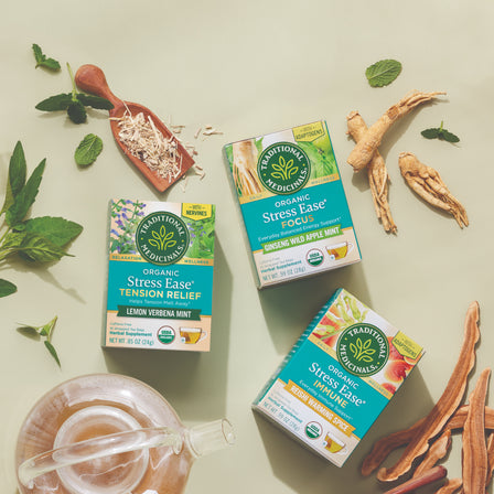 Stress Ease® Immune Tea boxes, which include revitalizing ingredients like mint, ginseng, and adaptogens such as reishi mushroom, are elegantly displayed on a light background.